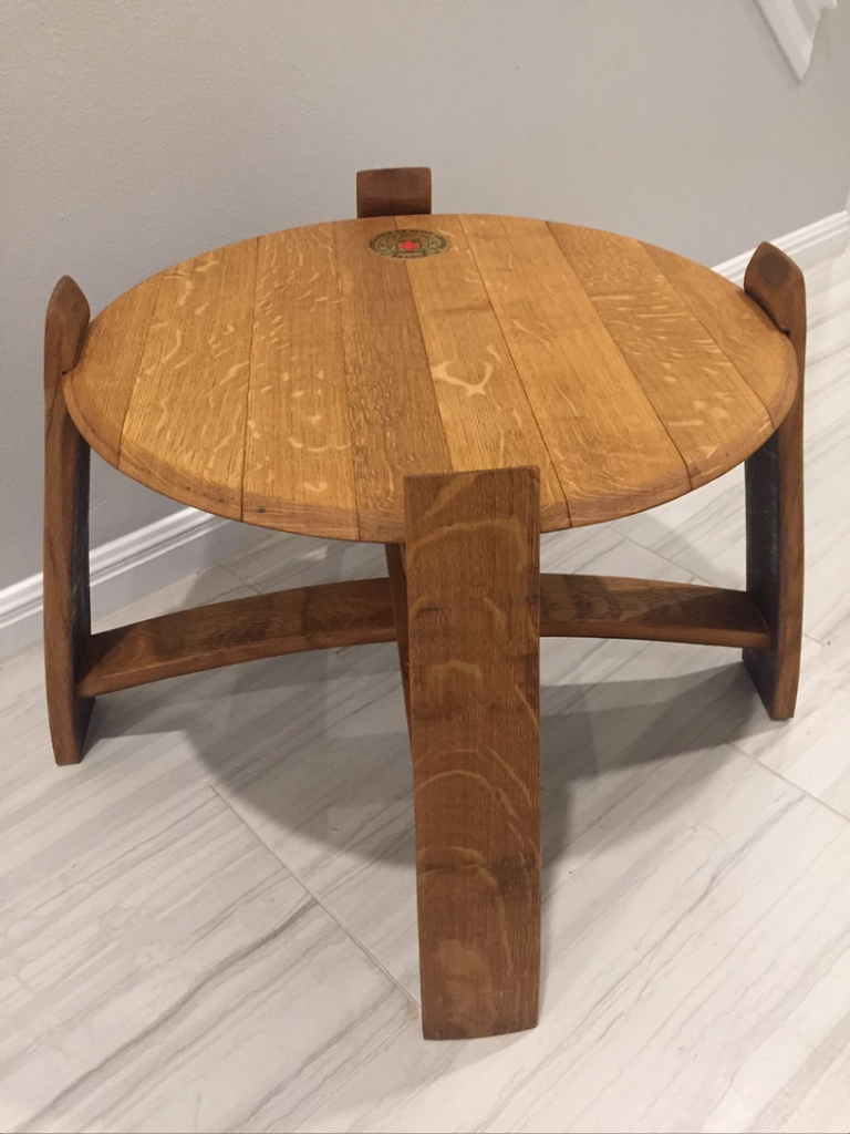 End table made from the head of a retired wine barrel