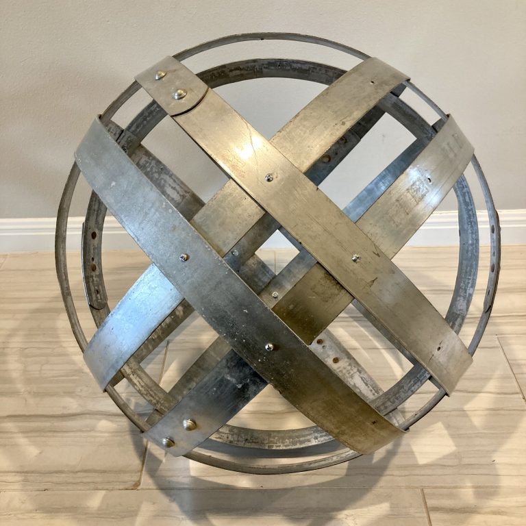 Metal globe art made from retired wine barrel hoops